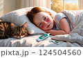 風邪を引き寝込んでいる女の子 124504560