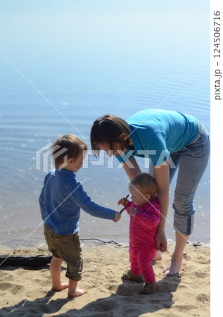 Family Moment by the Lake: Sharing and Bonding 124506716