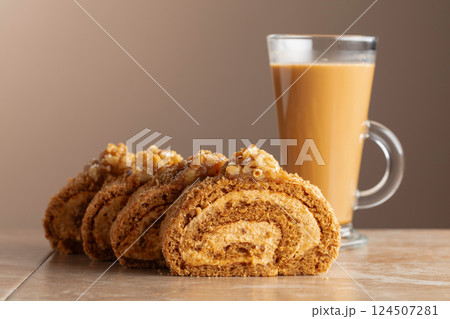 Walnut and buttercream roll: a traditional Oriental pastry. 124507281