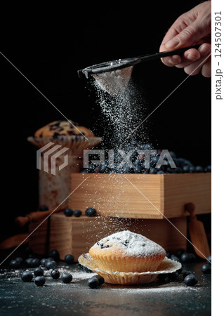 Blueberry muffins and berries in a wooden box. Blueberry muffins and berries in a wooden box. 124507301