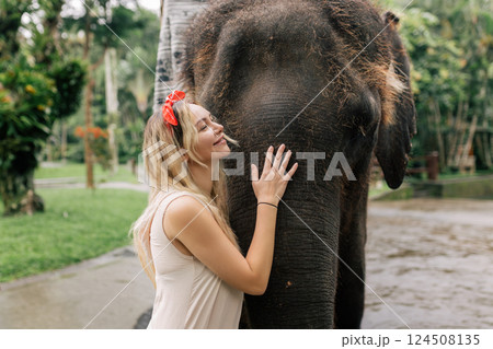 beautiful girl with smiling elephant, elephant village, bali beautiful girl with smiling elephant, elephant village, bali 124508135