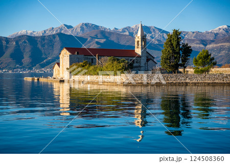 View of Our Lady of Mercy Island from yacht boat near Tivat city in Kotor bay of Adriatic sea in Montenegro in winter time View of Our Lady of Mercy Island from yacht boat near Tivat city in Kotor bay of Adriatic sea in Montenegro in winter time 124508360