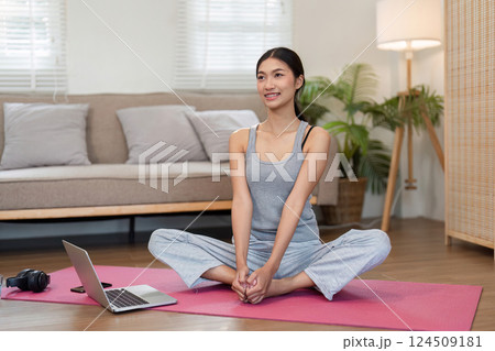 Mindfulness and Relaxation. A woman enjoys yoga in a soothing home space, embodying tranquility. Mindfulness and Relaxation. A woman enjoys yoga in a soothing home space, embodying tranquility. 124509181