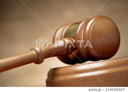 Wooden gavel on brown background 124509307