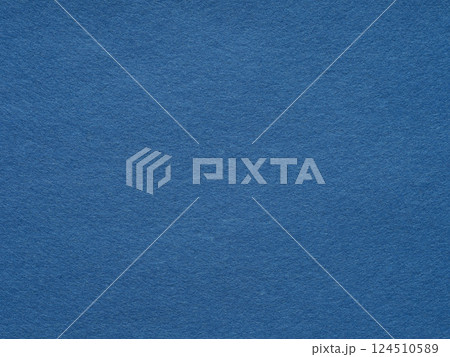 A serene canvas of cobalt blue, this textured felt surface exudes a calm, monochromatic elegance 124510589