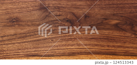 Texture of black walnut board with oil finish 124513343
