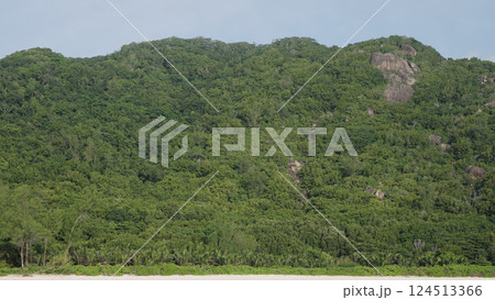 View form boat of Seychelles La Digue Island with sandy beach and lush forest in January View form boat of Seychelles La Digue Island with sandy beach and lush forest in January 124513366