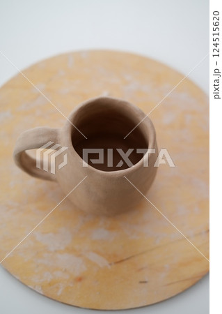Making pottery from clay, handicraft, clay modeling, master's hands Making pottery from clay, handicraft, clay modeling, master's hands 124515620