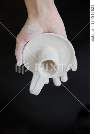 Making pottery from clay, handicraft, clay modeling, master's hands 124515623