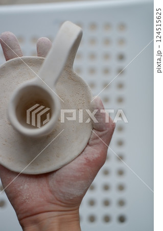 Making pottery from clay, handicraft, clay modeling, master's hands Making pottery from clay, handicraft, clay modeling, master's hands 124515625