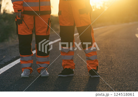 Engineer worker wearing safety suite walking survey inspect new road build for final quality check Engineer worker wearing safety suite walking survey inspect new road build for final quality check 124518061