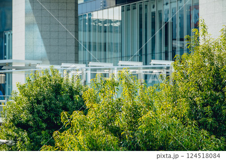 Eco friendly office building. modern city. Green tree in urban, metro green environment in Japan. 124518084