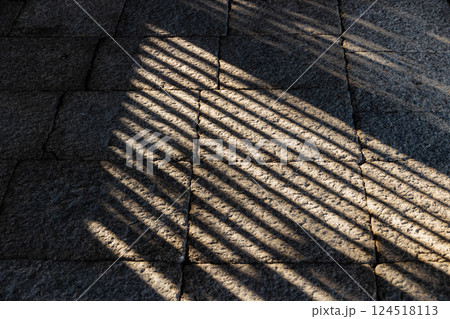 light shade and shadow line thought the wooden windows on the rock interior line pattern 124518113