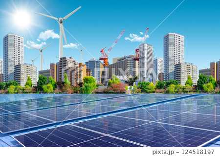 Clean Energy for Green City Concept. Wind Turbine and Solar Panel on Modern Metro Business Building 124518197