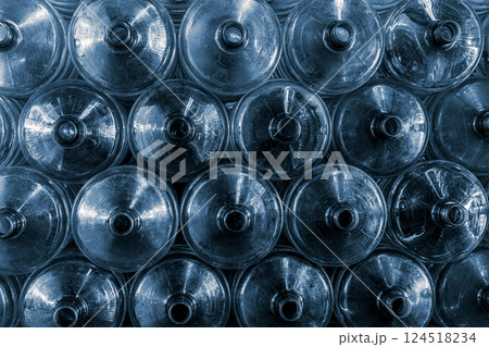 20 liters water gallon PET bottles stacked pile in drink water factory stock warehouse storage area 20 liters water gallon PET bottles stacked pile in drink water factory stock warehouse storage area 124518234