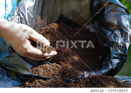 Peat moss, fertilizer soil for organic agriculture, plant growing, ecology concept. Peat moss, fertilizer soil for organic agriculture, plant growing, ecology concept. 124518623
