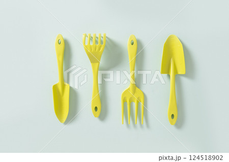 Various gardening hand green tools plastic isolated on blue background. Spring gardening. Concept season work. Top view. 124518902
