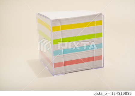 A paper block in the office. A block of paper for notes. A paper block in the office. A block of paper for notes. 124519859