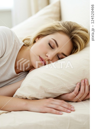 Woman sleeping in luxurious bed linens with an airy atmosphere Woman sleeping in luxurious bed linens with an airy atmosphere 124520466