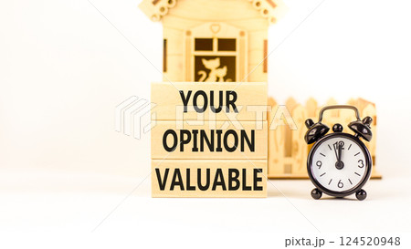 Your opinion valuable symbol. Concept words Your opinion valuable on beautiful wooden blocks. Beautiful white background. Black alarm clock. Business your opinion valuable concept. Copy space. 124520948