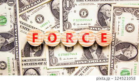 Force symbol. Concept word Force on beautiful wooden circles. Beautiful dollar bills. Beautiful background from dollar bills. Business lifestyle force concept. Copy space. Force symbol. Concept word Force on beautiful wooden circles. Beautiful dollar bills. Beautiful background from dollar bills. Business lifestyle force concept. Copy space. 124521058