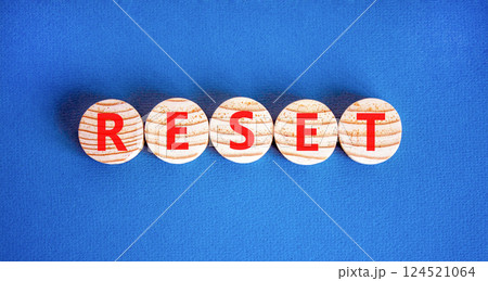 Reset symbol. Concept word Reset on beautiful wooden circles. Beautiful blue table blue background. Business lifestyle reset concept. Copy space. Reset symbol. Concept word Reset on beautiful wooden circles. Beautiful blue table blue background. Business lifestyle reset concept. Copy space. 124521064