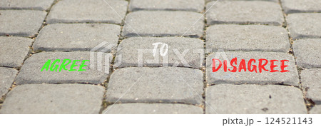 Agree to disagree symbol. Concept words Agree to disagree on beautiful grey road break. Beautiful grey road break background. Business and agree to disagree concept. Copy space. Agree to disagree symbol. Concept words Agree to disagree on beautiful grey road break. Beautiful grey road break background. Business and agree to disagree concept. Copy space. 124521143