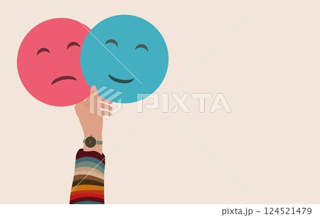 Hand holding 2 double emoji Head one smiling and the other sad.Metaphor bipolar disorder mind mental.Mood disorder Concept.Psychology.Mental health.Split personality.Banner copy space Hand holding 2 double emoji Head one smiling and the other sad.Metaphor bipolar disorder mind mental.Mood disorder Concept.Psychology.Mental health.Split personality.Banner copy space 124521479