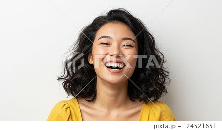 Portrait of a laughing young woman on white background 124521651