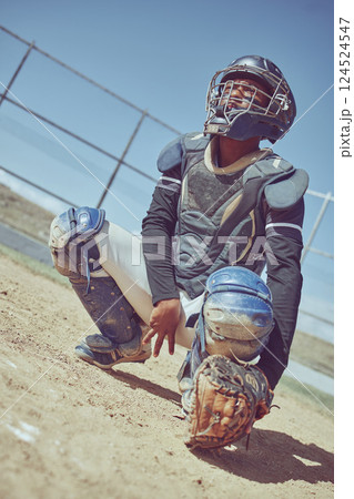 Sports, baseball and catcher ready in a game, match or training on outdoor baseball field. Fitness, exercise and baseball player with focus, concentration and determination to win baseball game Sports, baseball and catcher ready in a game, match or training on outdoor baseball field. Fitness, exercise and baseball player with focus, concentration and determination to win baseball game 124524547