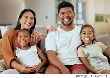Family, parents with children and together in family home, smile in portrait, bonding on living room sofa. Man, woman and kids, happy childhood and spending quality time, girls sit with mom and dad. 124524561
