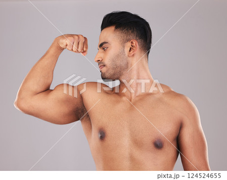 Muscle, arm and man strong from training for health, goal and body against a grey mockup studio background. Power, pride and athlete with bicep to show progress with workout, exercise and fitness Muscle, arm and man strong from training for health, goal and body against a grey mockup studio background. Power, pride and athlete with bicep to show progress with workout, exercise and fitness 124524655