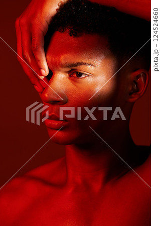 Red beauty, light and face of model with creative shadow design, artistic neon lighting and luxury skincare. Sweat, hard work and aesthetic creativity of serious black man isolated on red background 124524660