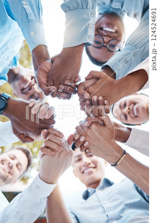 Low angle, business people and holding hands in support circle, community partnership or team building motivation. Smile, happy or teamwork diversity in trust, collaboration or growth mission success 124524691