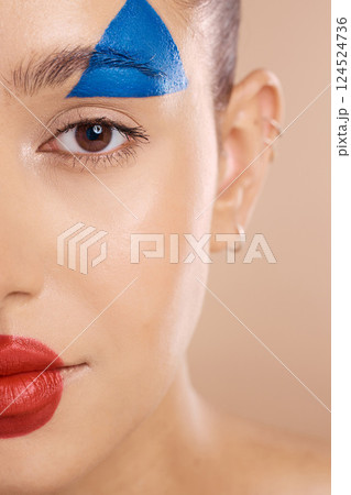 Art, woman face and makeup clown paint, cosmetics and skincare being goofy, facial and brown studio background. Portrait, young female happy or creative girl with colorful, smooth or skin artist Art, woman face and makeup clown paint, cosmetics and skincare being goofy, facial and brown studio background. Portrait, young female happy or creative girl with colorful, smooth or skin artist 124524736