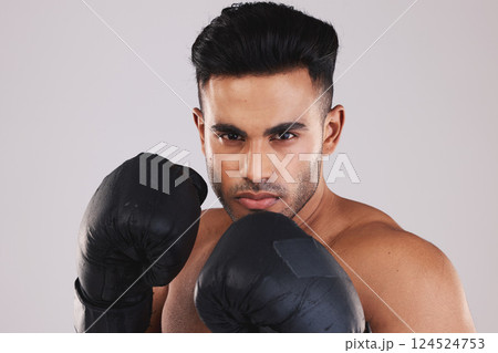 Sports, boxing and portrait of man with boxing gloves isolated on white background studio. Fitness, exercise and Indian man training with determination, focus and motivation for winning match or game Sports, boxing and portrait of man with boxing gloves isolated on white background studio. Fitness, exercise and Indian man training with determination, focus and motivation for winning match or game 124524753