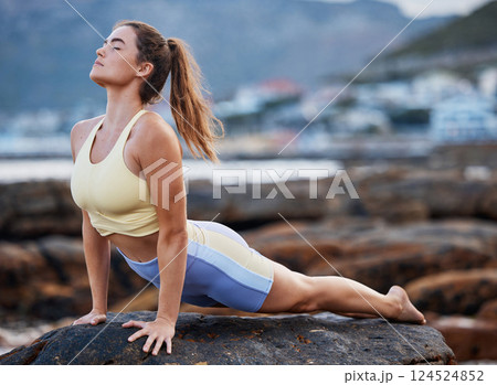 Meditation, yoga stretching and woman on rock at beach for mindfulness peace exercise, spiritual healing and wellness training to relax. Zen workout, outdoor lifestyle and pilates for health fitness 124524852
