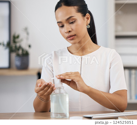 Business woman sanitizing her hands in an office for hygiene, stop germs and protection. Hand sanitizer, clean and corporate employee from Mexico with coronavirus safety compliance in the workplace. Business woman sanitizing her hands in an office for hygiene, stop germs and protection. Hand sanitizer, clean and corporate employee from Mexico with coronavirus safety compliance in the workplace. 124525051