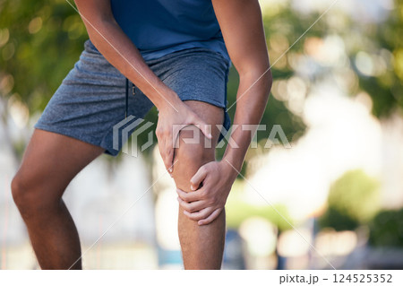 Knee pain, hands and man with injury during exercise, training and running in a park, pain and inflammation. Hand, fitness and arthritis in leg of runner during workout, sport and practice outdoors 124525352