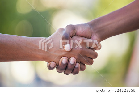 Hands, handshake and friendship in trust, support or care for relationship, agreement or unity against bokeh background. Hand of people shaking for community, collaboration or partnership deal 124525359