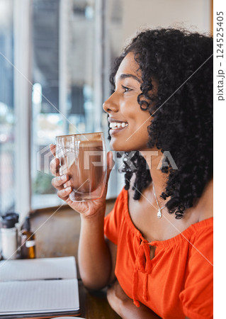 Coffee shop, thinking and writing with a black woman freelancer drinking a beverage with an idea in mind. Cafe, book and creative with a young female customer enjoying freedom in a restaurant Coffee shop, thinking and writing with a black woman freelancer drinking a beverage with an idea in mind. Cafe, book and creative with a young female customer enjoying freedom in a restaurant 124525405