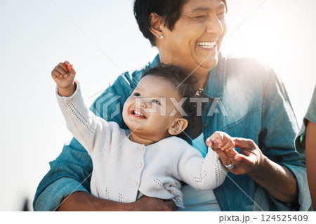 Happy grandma, baby and relax in nature on vacation, trip or family holiday. Love, care and grandmother bonding with child, infant or toddler outdoors, outside in sunshine and enjoying time together. 124525409