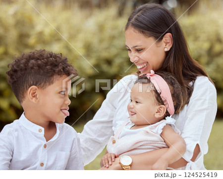 Family, happy and children with a mother having fun with tongue out gesture in a nature park. Kids, comic and funny quality time of a mom, boy and baby together with happiness, love and youth 124525419