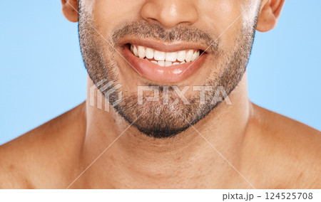 Teeth, mouth and beard of a man with a smile for dental, health and wellness against a blue studio background. Healthcare, lips and face of a happy and clean model with results from care for tooth Teeth, mouth and beard of a man with a smile for dental, health and wellness against a blue studio background. Healthcare, lips and face of a happy and clean model with results from care for tooth 124525708