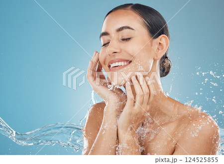 Beauty, skincare and splash of water with woman for wellness, hydration and fresh spa. Relax, smile and health with girl against blue background with mock up for luxury, natural cosmetics and shower Beauty, skincare and splash of water with woman for wellness, hydration and fresh spa. Relax, smile and health with girl against blue background with mock up for luxury, natural cosmetics and shower 124525855