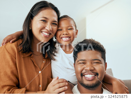 Happy family, mother and father with child in a portrait enjoying quality time with big smiles on their faces. Young kid, mama and dad love relaxing together on a living room sofa in a house in Peru 124525875