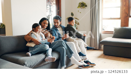 Relax, watching tv and love with family on sofa for bonding, show and streaming. Movie, happiness and connection with parents and children in living room of home for support, smile or film together 124526133