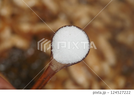 Salt being added to enhance flavors in a cooking process Salt being added to enhance flavors in a cooking process 124527222