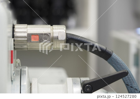Connector on machinery shows industrial equipment usage 124527280