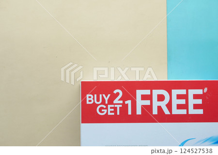 Promotion for buying two items and getting one for free 124527538
